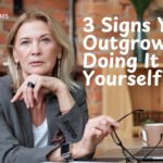 Business owner reviewing systems and workflows for a growing business
